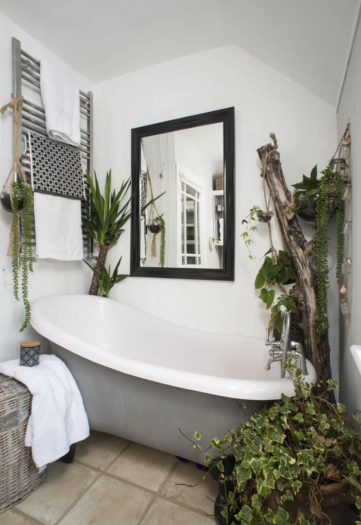Danecia has created a luxury spa look on a budget in her bathroom, painting the roll-top bath in Farrow & Ball’s Mole’s Breath and adding lots of lush greenery so it feels like an exotic retreat