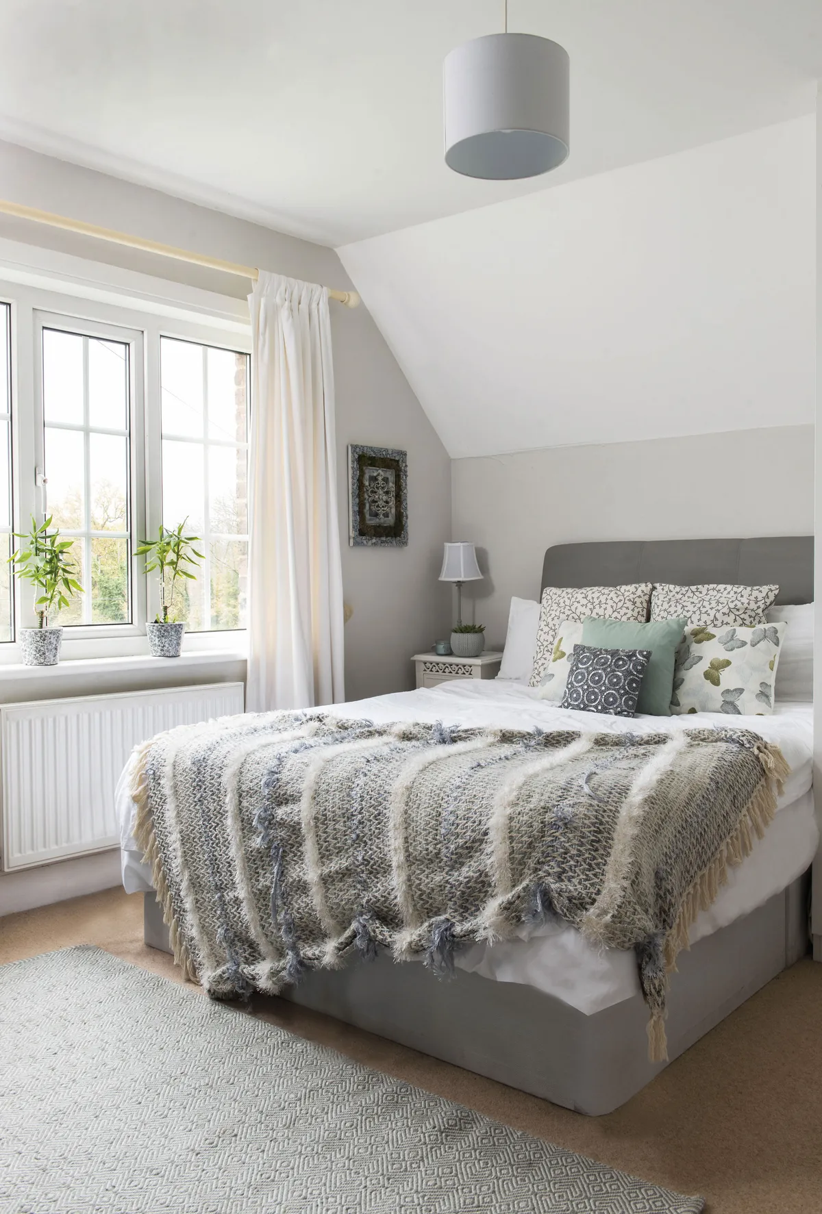 Danecia has incorporated her love of the countryside into her schemes with plants, botanical prints and textured textiles in natural fabrics. She’s styled the guest bed with butterfly cushions and a tactile throw to make it super cosy