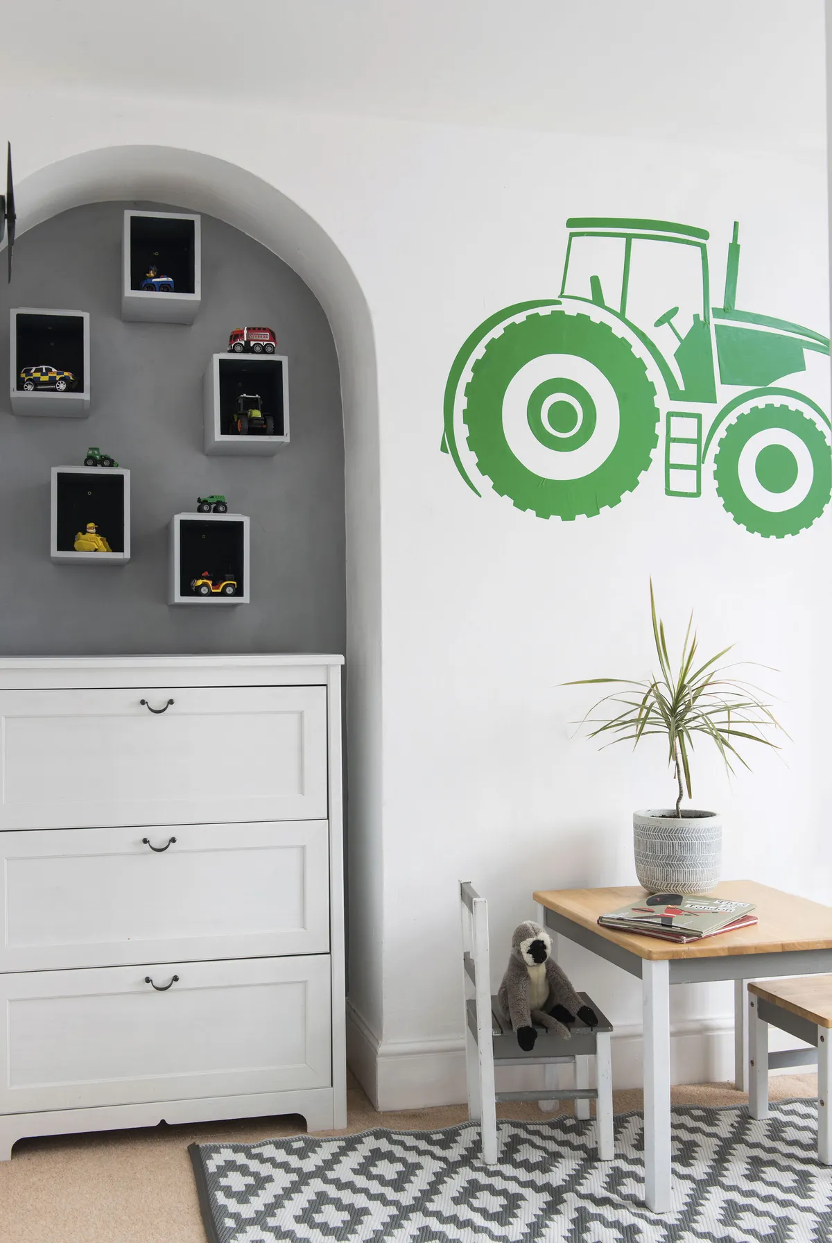 A tractor wall decal injects colour and nods to the family’s country lifestyle, and Danecia has added cute box shelves for Raydan’s favourite toys
