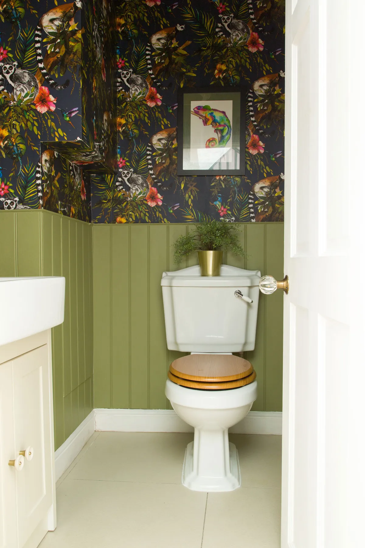 Make a feature of a cloakroom bathroom with a bold pattern. ‘We panelled the lower half of the wall so the print didn’t become overwhelming,’ says Kate. ‘It’s a super fun space, and we always get comments on it’