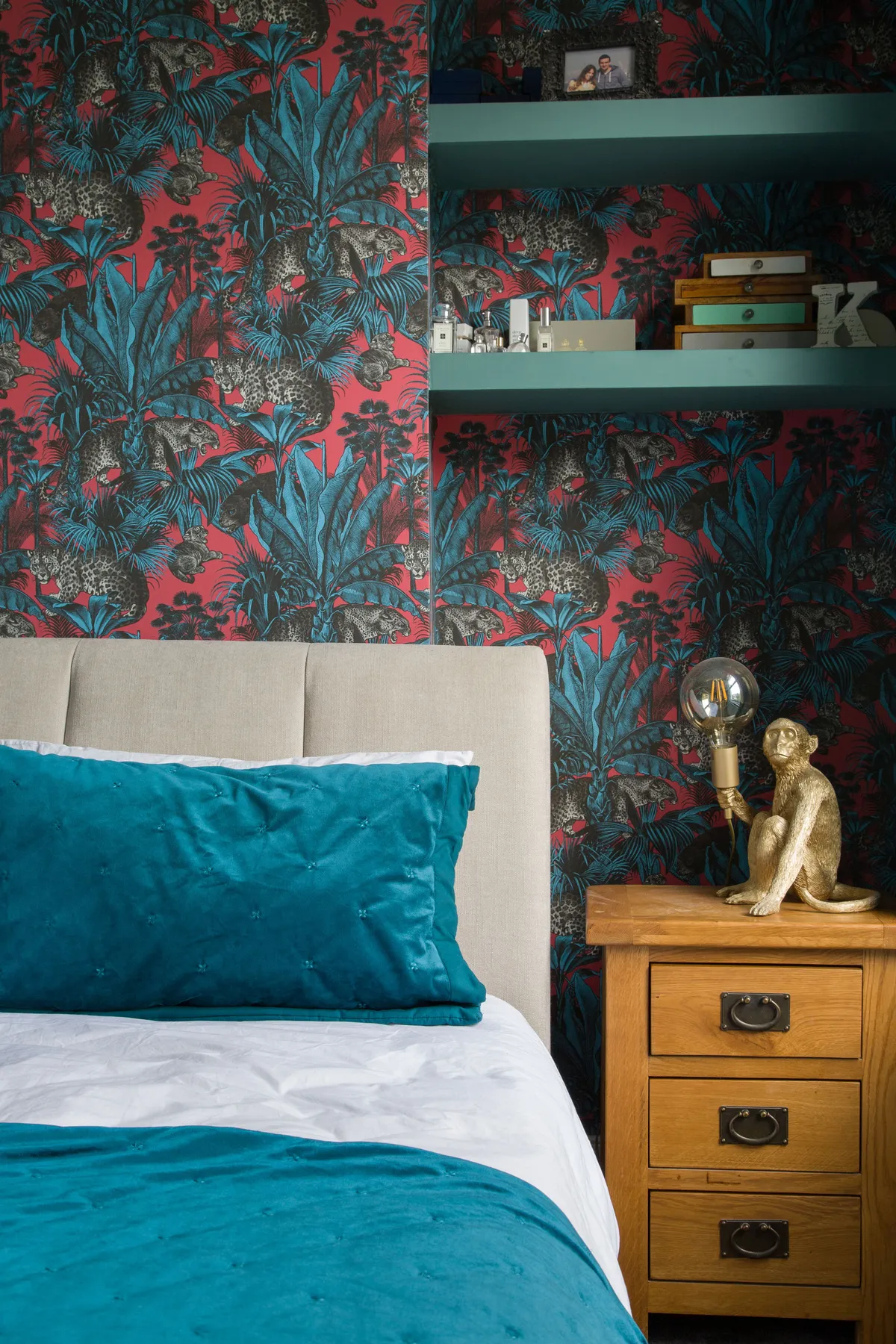 The main bedroom was the only room not in need of any building work, but Kate still put her creative stamp on it. She built her scheme around the wallpaper from Divine Savages, matching the teal tones with luxe bedding