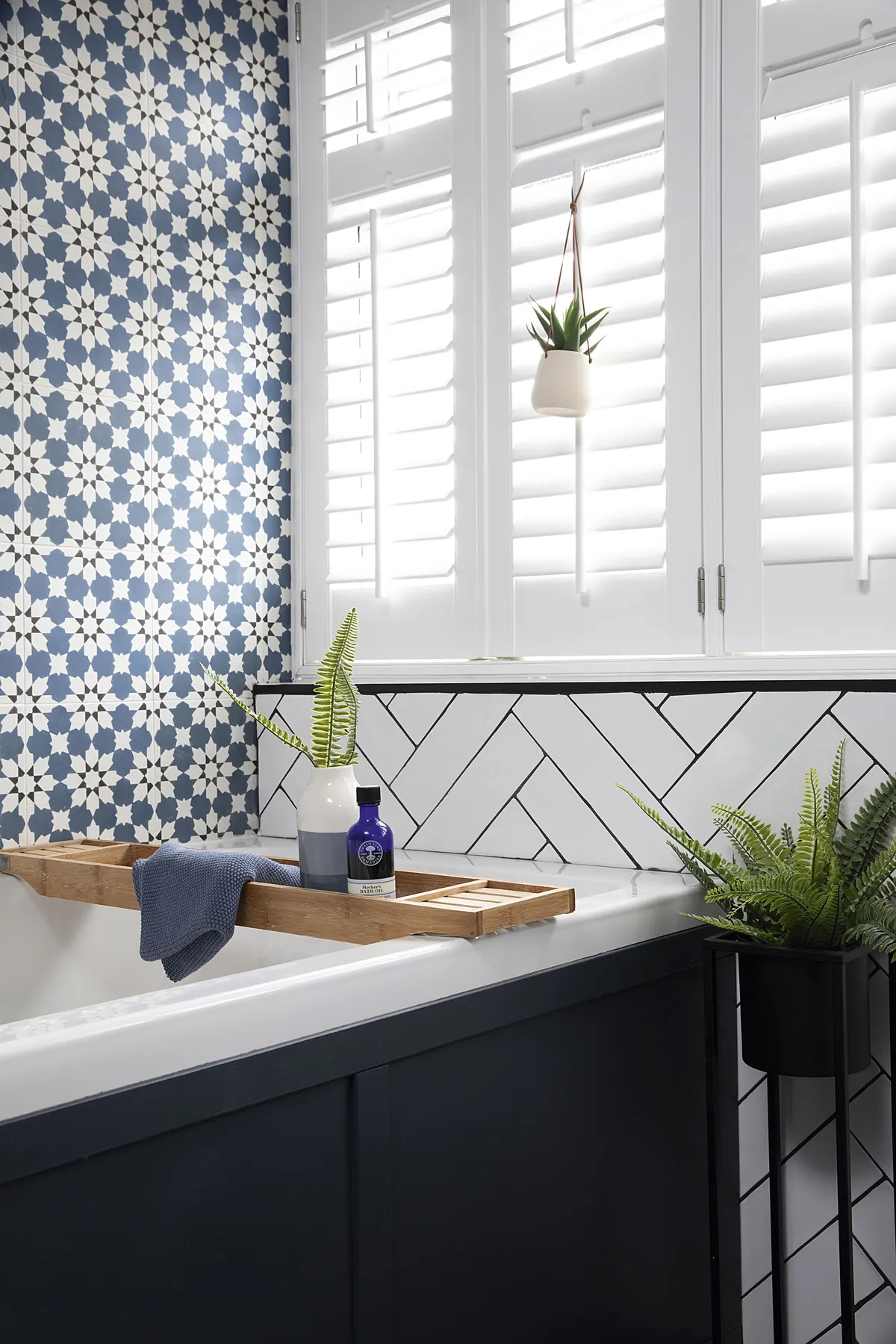 It’s the subtle touches as well as the statement tiles that give Claire’s scheme a holiday feel, including white window shutters and plants and succulents dotted around the space