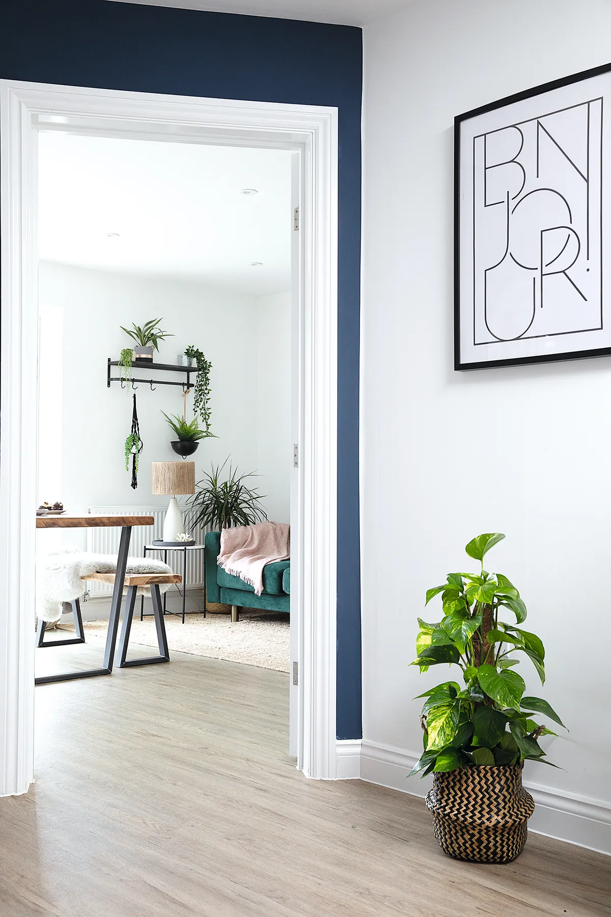 ‘I chose Quayside oak flooring by Camaro to run throughout the ground floor. It has a lovely wood effect but with a grey tone to tie in with the kitchen units. The Bonjour print is from H&M Home and I picked up the plant basket at Habitat’