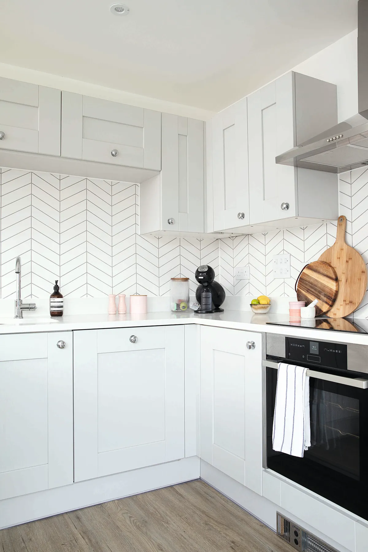 ‘We added the chevron wall tiles from Porcelain Superstore and new cupboard handles after we moved in. Previously the splashback area was just painted, with a chrome panel behind the hob, so this has really finished it off’