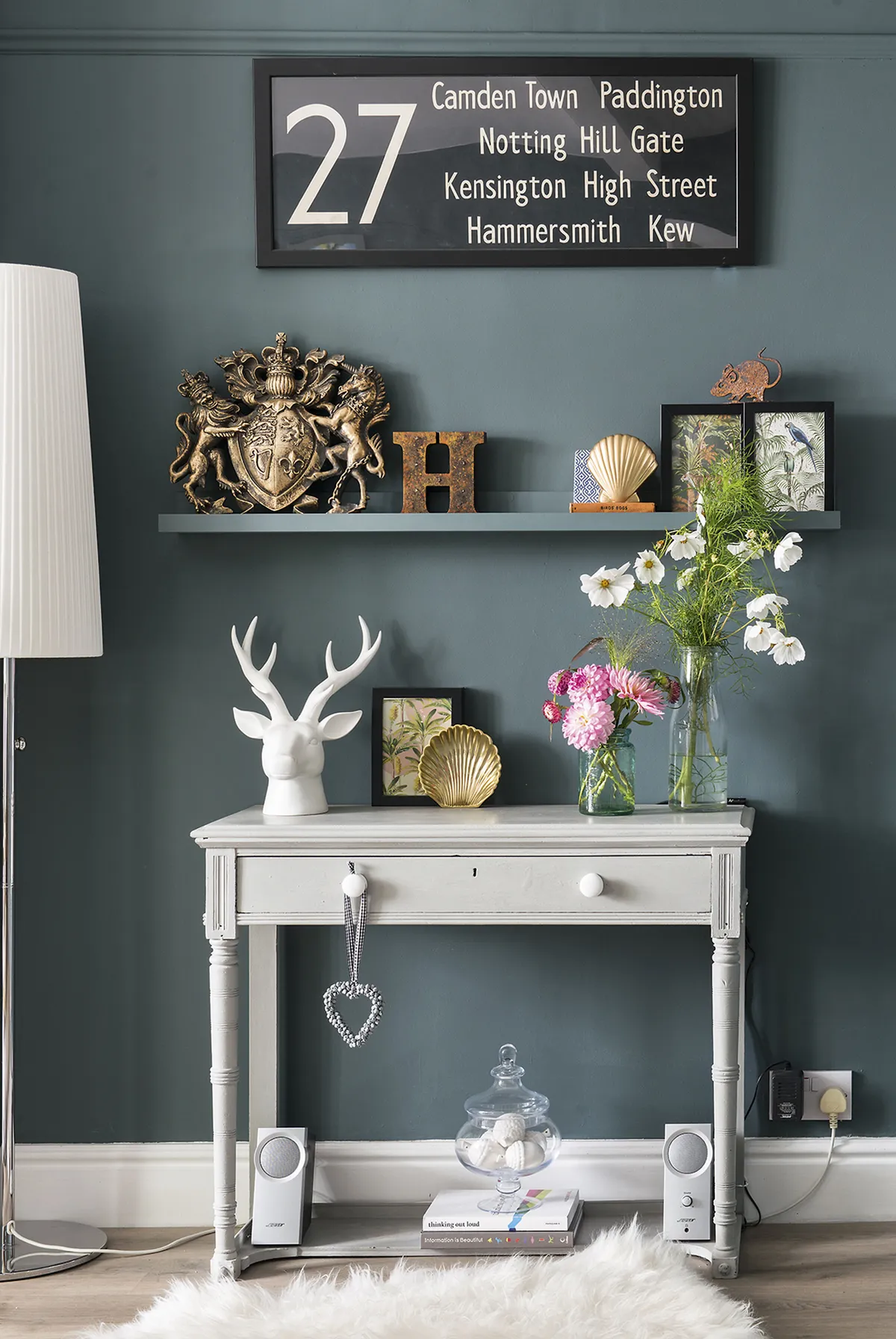 Sarah spotted a console table at The Quiet Woman Antiques Centre in Oxfordshire and painted it in Annie Sloan’s Paris Grey. In keeping with its vintage look, she has added retro accessories, including the London bus blind, found on eBay, on the wall above