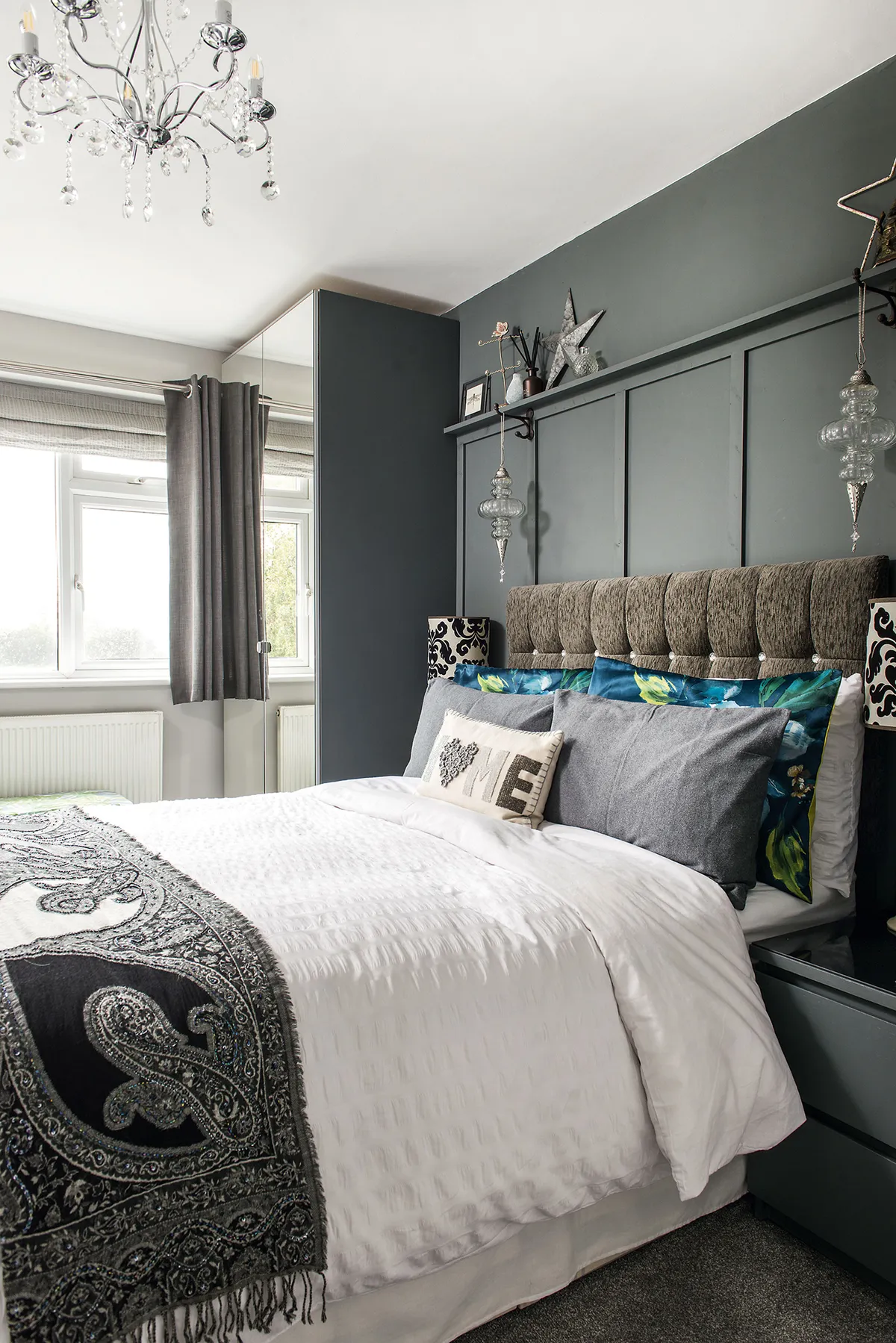 The couple have combined panelling, painted in Farrow & Ball’s Down Pipe, and a velvet headboard from eBay to create a luxurious sanctuary in their main bedroom
