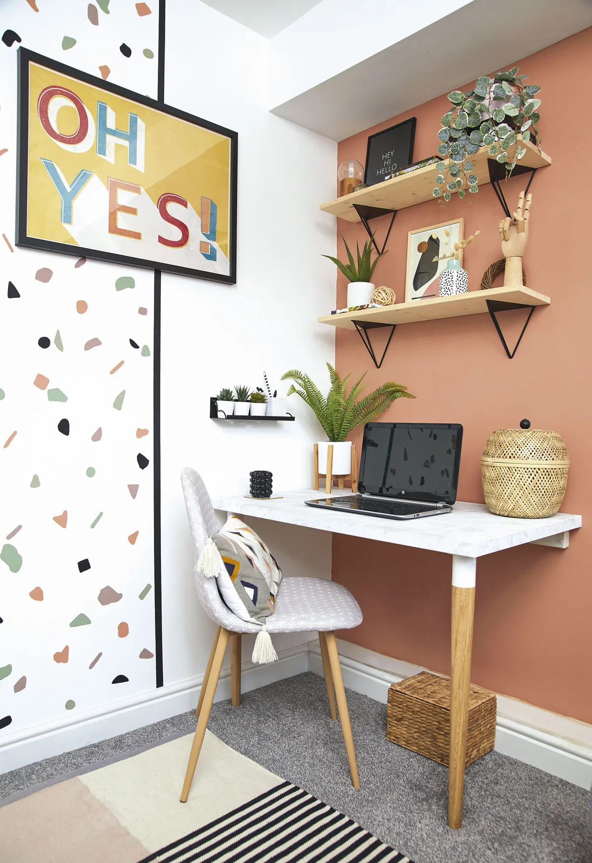 ‘The desk is made from an IKEA tabletop that I wrapped in marble-effect vinyl, and then we added two legs and attached it to the wall. The wall is painted in Copper Blush by Dulux and I bought the ‘Oh Yes’ print in the sale from Next years ago – it’s finally found its place on this wall!’