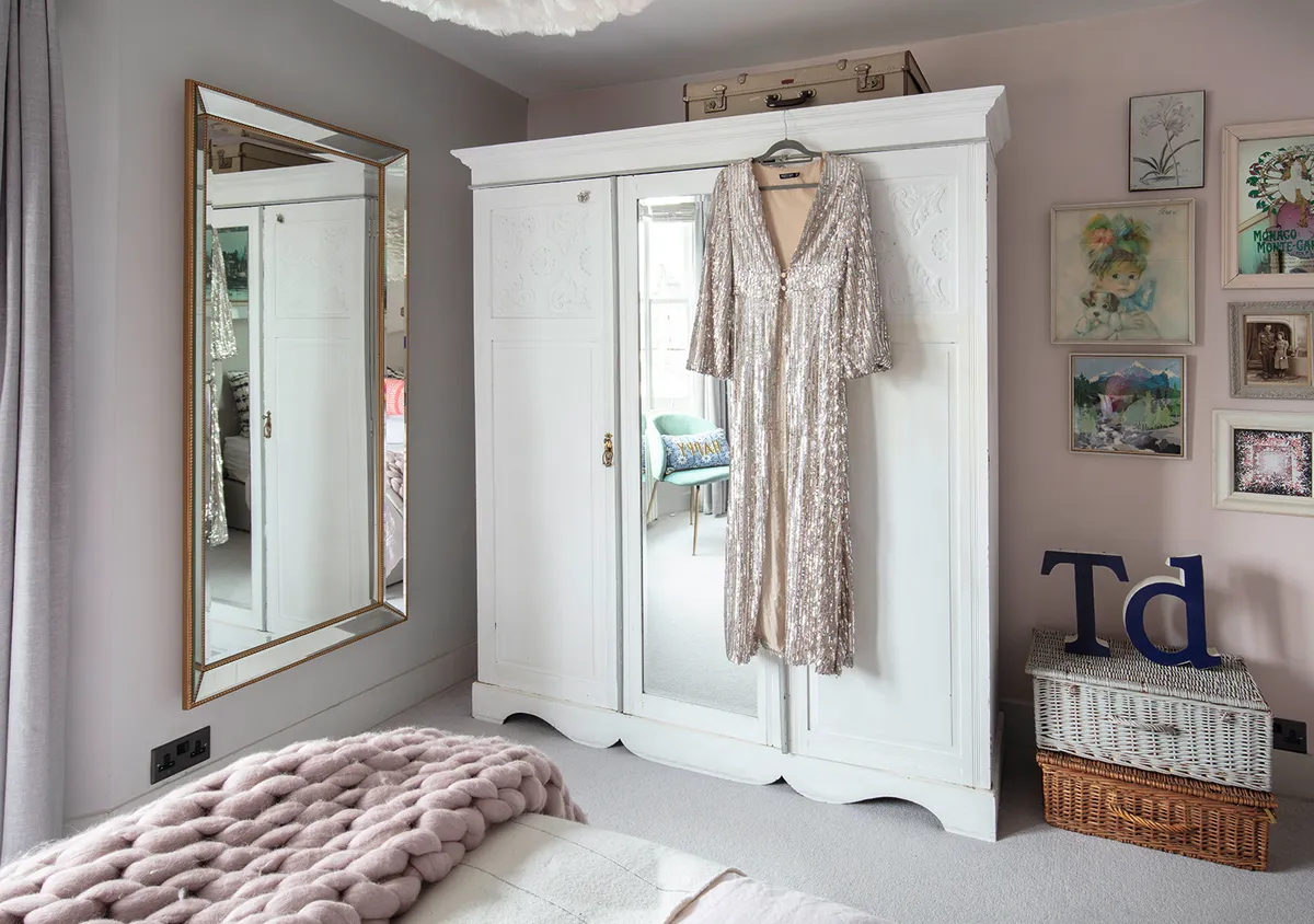 The vintage wardrobe was a Gumtree find. Maxine painted it with Annie Sloane white chalk paint, so the furniture blends seamlessly into her room
