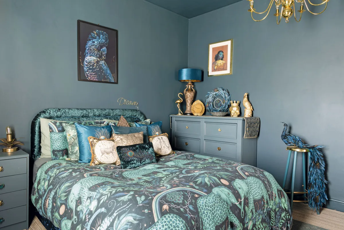 ‘I am the Cushion Queen and piling my bed with pillows is an easy way to add a touch of hotel luxe to the room. My sister bought me the peacock and it’s been the inspiration for the colour scheme in here’