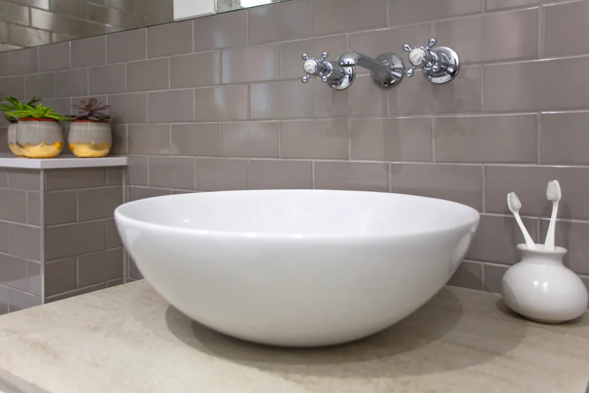 Heather chose the bowl-like basin for its simple, elegant shape, but it also takes up less room, too