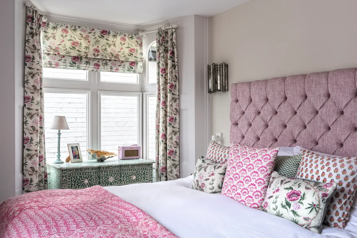 Curtains and Roman blind made up in Helene in fuchsia from the Fleurons d’Helene collection