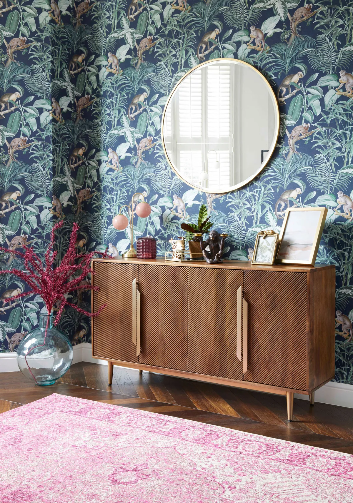 Jungle luxe Navy wallpaper, £12 per roll; Anya large sideboard, £529; Mila Magenta rug, from £65, all Dunelm