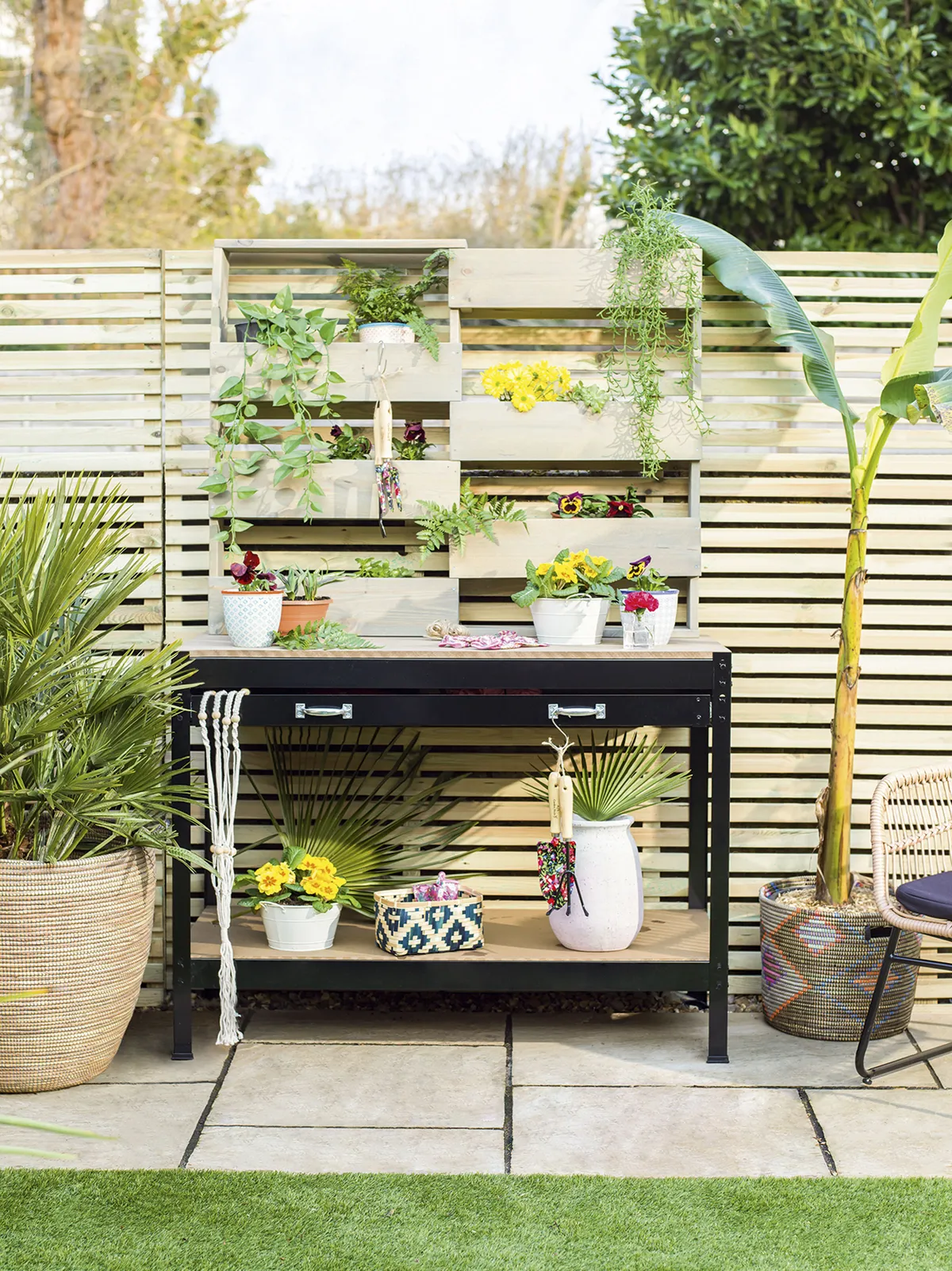 It’s not just inside the garden room that AJ has transformed. Outside, she’s set up a potting station, where she’s growing herbs, houseplants and flowers