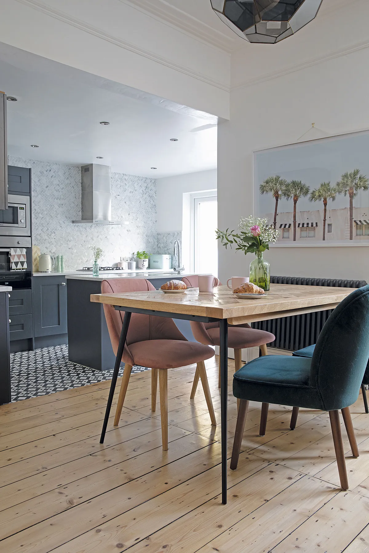 ‘The dining area is much lighter now we have two sets of French doors at the back. The Palm tree print from HomeSense ties in well with my pink and green colour scheme’