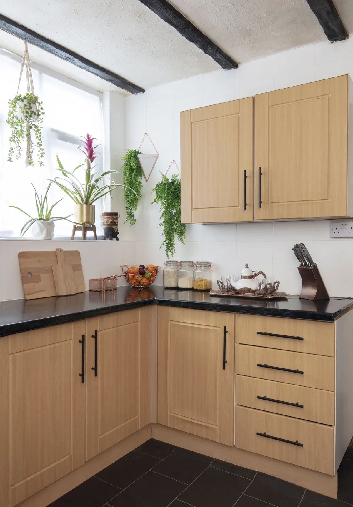 The kitchen is on their renovation to-do list. ‘I’m going to play with the layout and swap some wall cabinets for open shelving. I spend a lot of time in the kitchen, so I want a breakfast bar,’ says Alimah. ‘I’ll keep the beams but paint them’