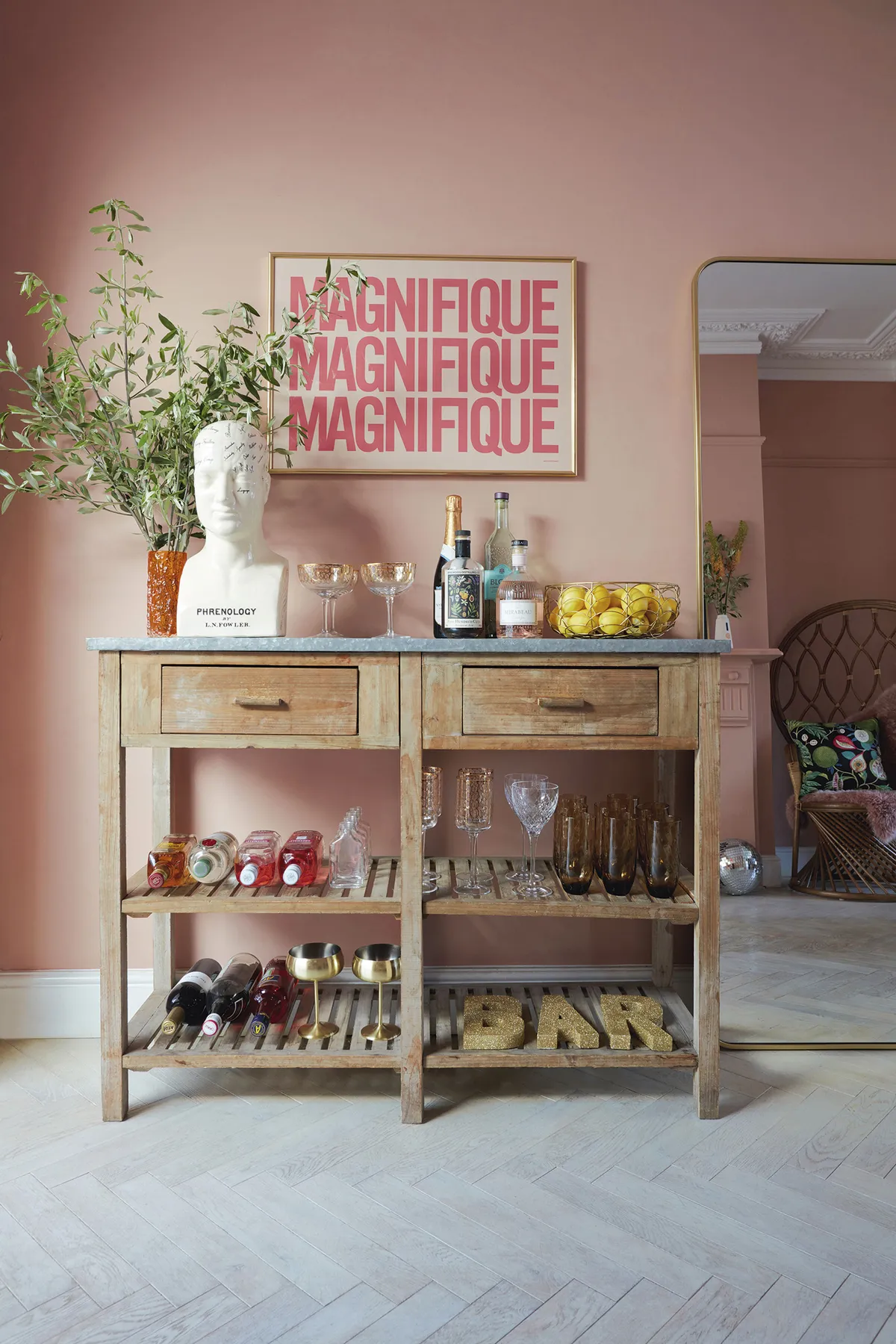 ‘The distressed table was a vintage find and I thought it would make a perfect drinks table.’ Styled with bottles and cocktail glasses, Natalie has created a fun-filled entertaining space, with the ‘Magnifique’ print adding to the party atmosphere. For a similar drinks cabinet, try Nkuku