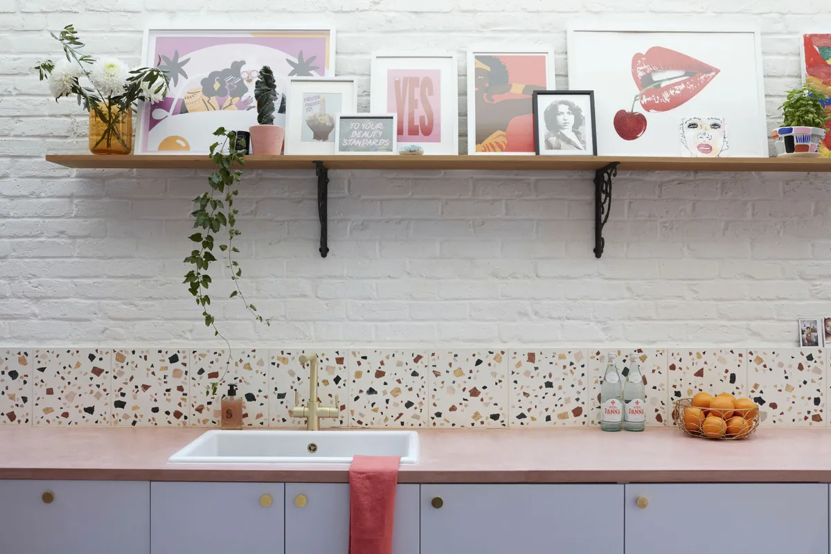 Terrazzo tiles from Mosaic Factory form a contemporary splashback. The lilac cupboard doors and brass knobs are both from Superfront