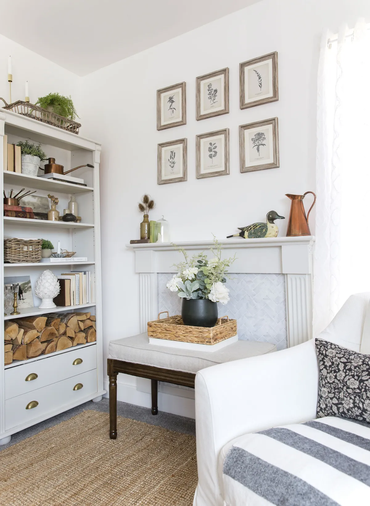 Stick-on tiles from Amazon have been used to fill the area inside the fireplace, while a bench from eBay sits in front and provides extra seating when needed. The bookcase was free on Facebook Marketplace and is perfect for showcasing Tilly’s vintage finds