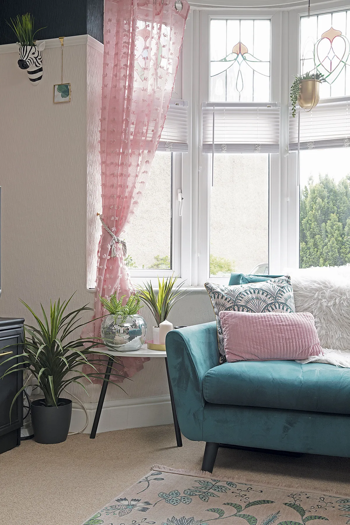 Pink voile curtains from The Range allow plenty of light in. ‘Most stained-glass windows have traditional colours, but these pink and pale blue ones are special,’ says Leanne. ‘They’re one of my favourite things in the house’