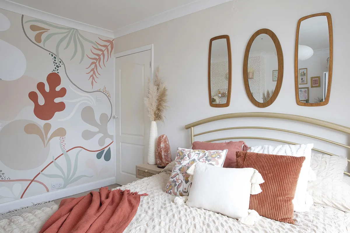 ‘I took my cue for the soft furnishings from the autumnal colours of the wall mural,’ says Leanne. ‘I wanted to bring some warmer tones into what was a very neutral colour palette without going too bold’