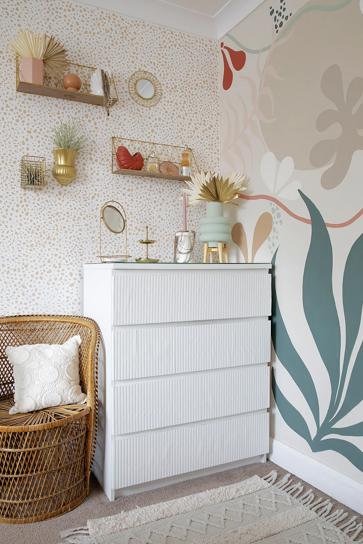 Some clever upcycling has given these scratched drawers a new lease of life. ‘I considered wooden dowels on the front, but it would’ve been time-consuming to do, so I used wallpaper instead to give a similar effect.’ The gold shelves are from B&M