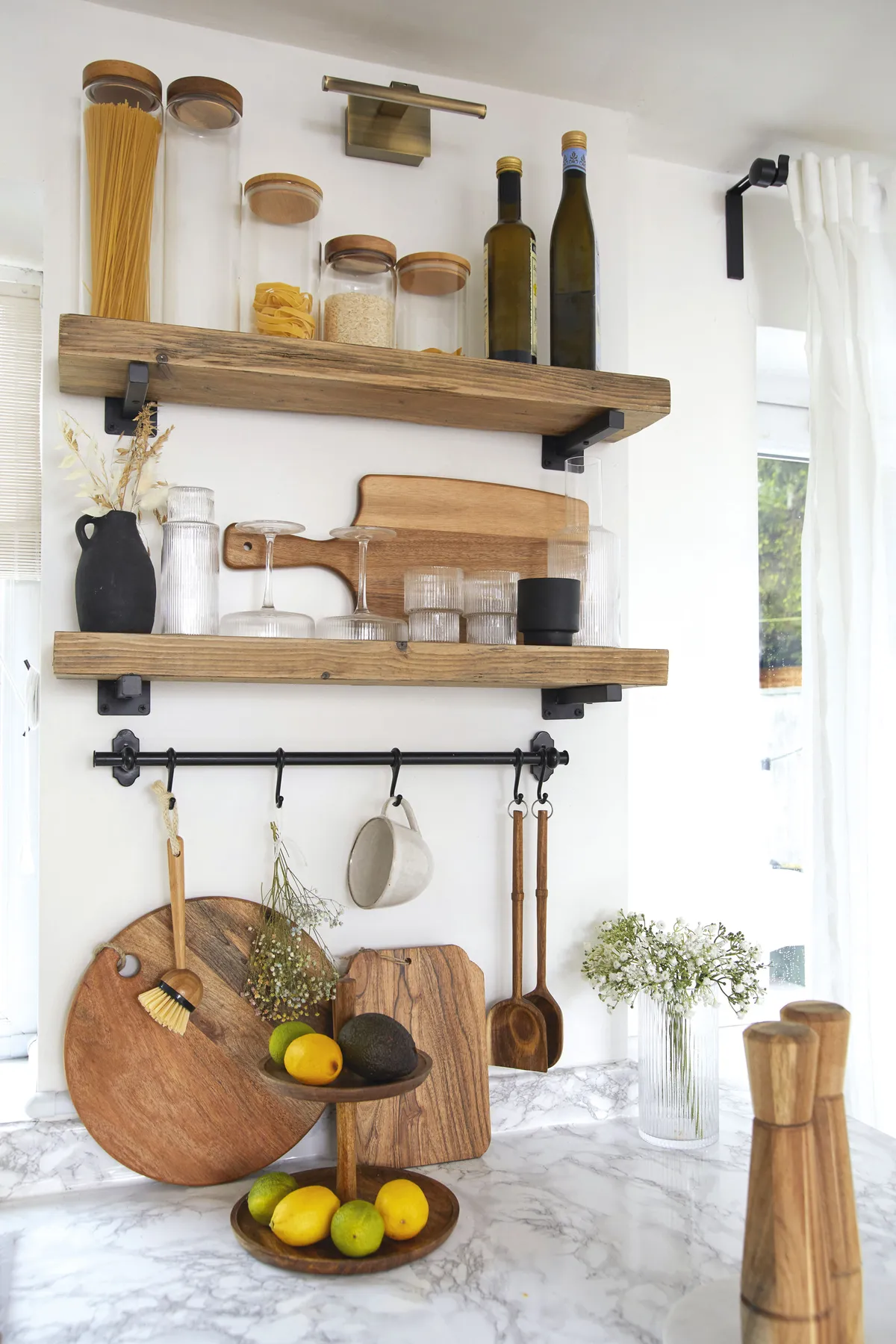 ‘Making your own scaffold shelves out of spare wood is so easy; you just need to invest in the tools. I cut them to size, sanded and varnished the wood and then hung them on brackets’