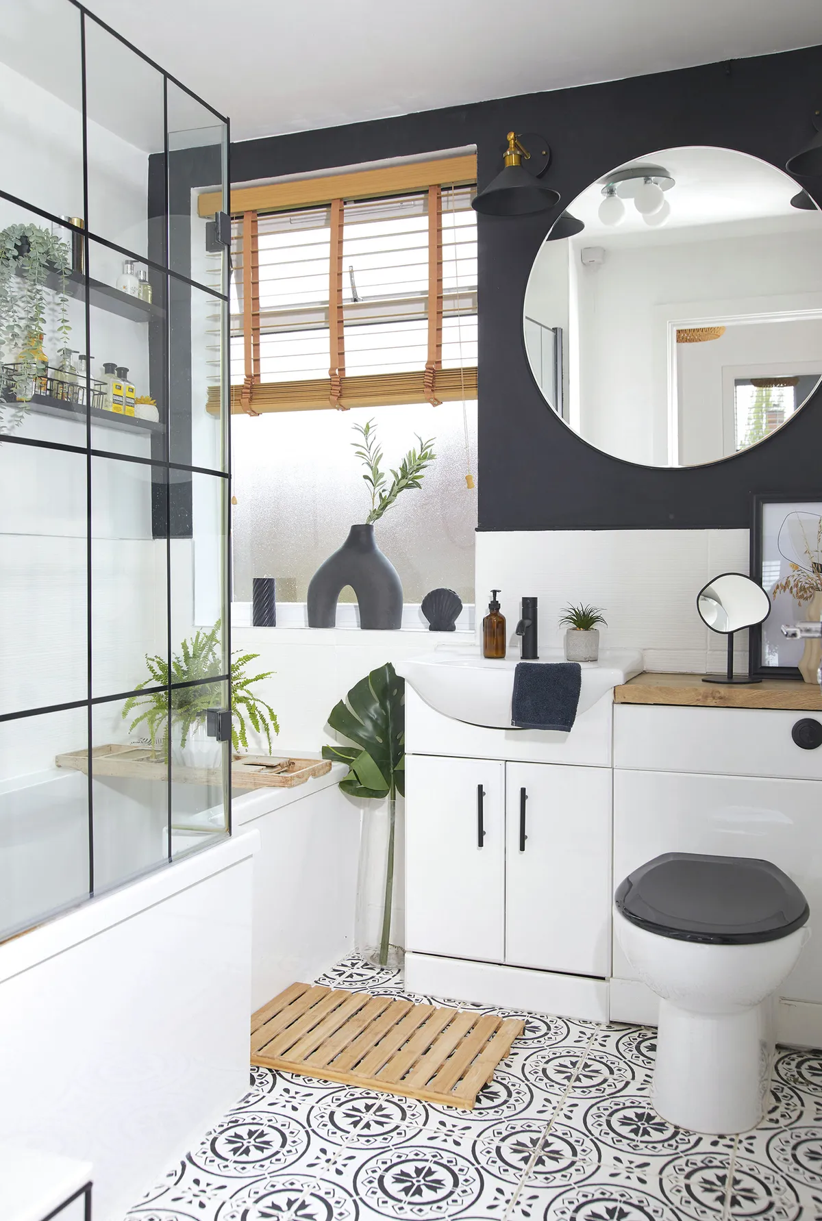 ‘I painted the shower screen black and then used electrical tape to make it look like a Crittall-style screen. I added the black loo seat to finish the look’