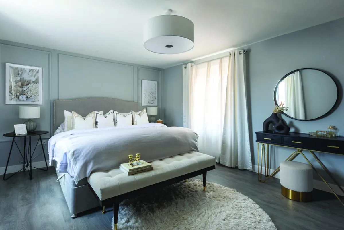 Contrasting greys and neutrals with black and gold accents creates a plush feel in the main bedroom. Dulux’s Light Rain and layered putty and cream textiles create a sophisticated hotel vibe