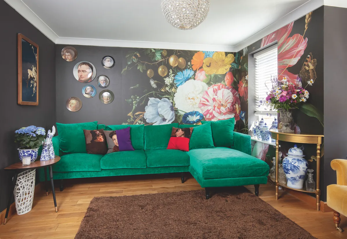 A custom-printed mural of a floral Dutch painting brings an explosion of pattern and life to the living room. Anna painted the other walls to match the mural’s background colour so it blends in seamlessly