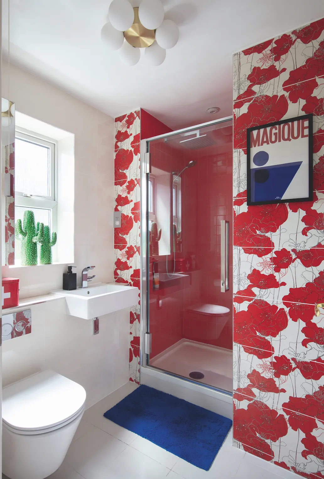 As in the rest of her home, Anna went bold in the bathroom, having hand-painted poppy tiles shipped over from Poland and pairing them with splashes of vivid cobalt to echo the main bedroom scheme