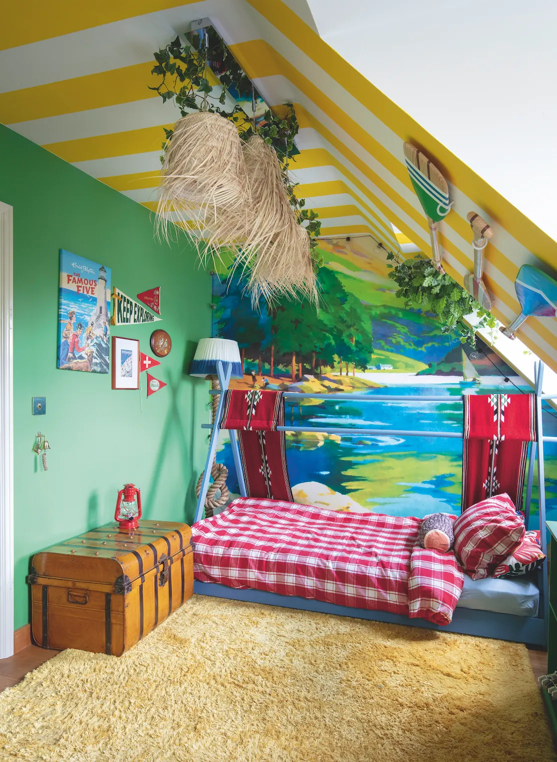 The mural in Tony’s bedroom was made from a vintage travel poster Anna had enlarged, and she painted the yellow stripes and made themed accessories herself. ‘Pretty much everything in his room has been made or customised by me,’ she says