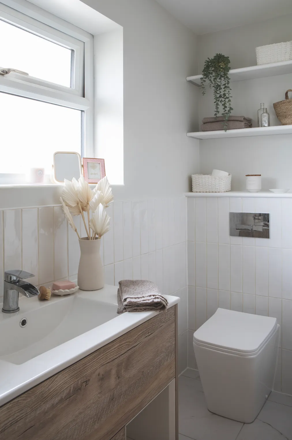 As the rest of her bathroom scheme is white and marble, Becca added warmth with natural tones. ‘I wanted a textured vanity in a colour contrast with the white tiles and fell in love with this wood-effect style for its Scandi look,’ says Becca
