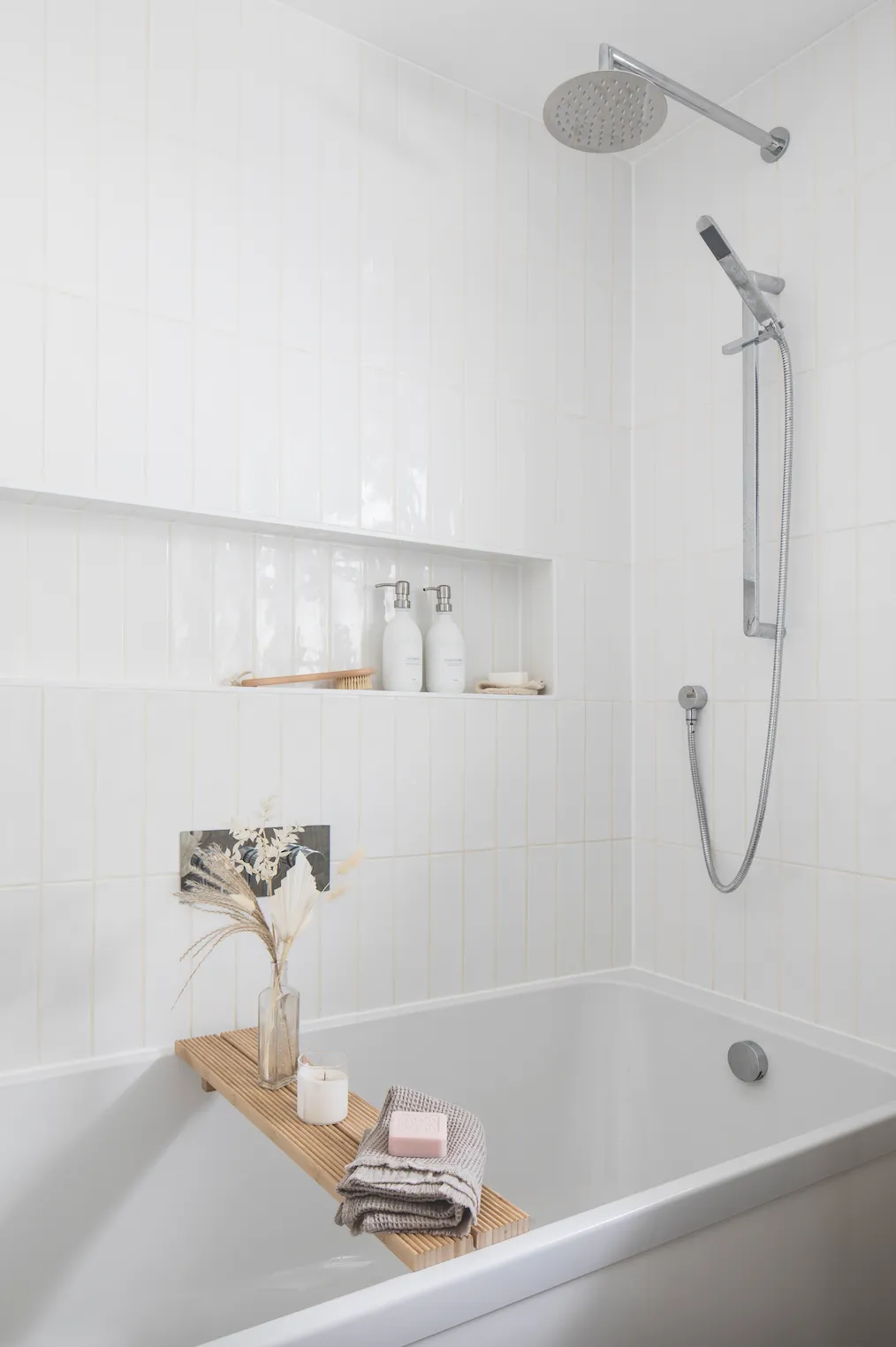 Laying Porcelain Superstore’s glossy white metro tiles vertically, and white marble-effect tiles on the floor, makes the space feel bigger. ‘They’re well-priced and good quality, with enough detail on them so the room doesn’t look flat,’ says Becca