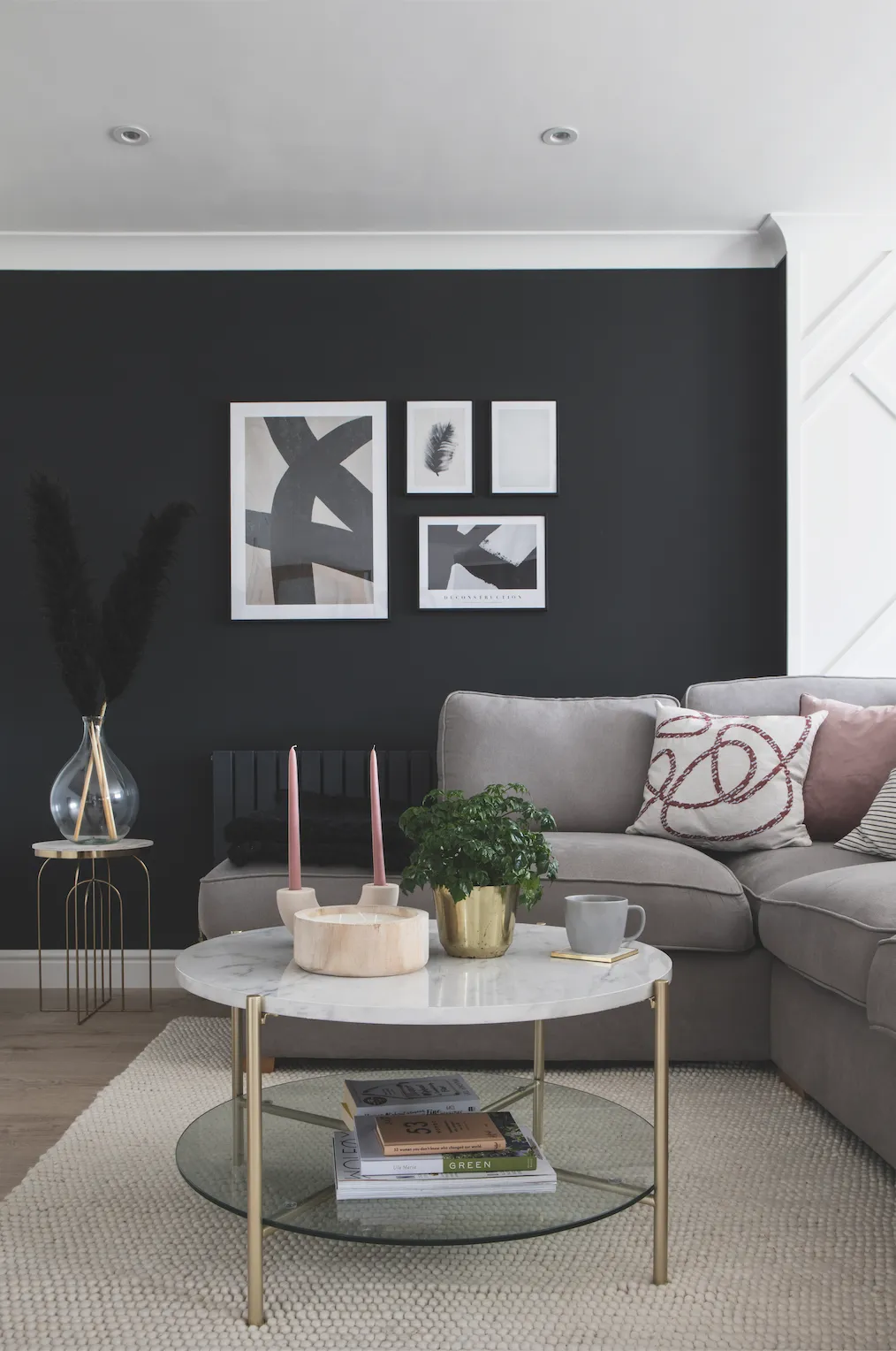 Becca has echoed her geometric wall panel with abstract lines and curves on cushions, accessories and prints and matched the marble-effect kitchen worktop with a sleek coffee table to tie it all together