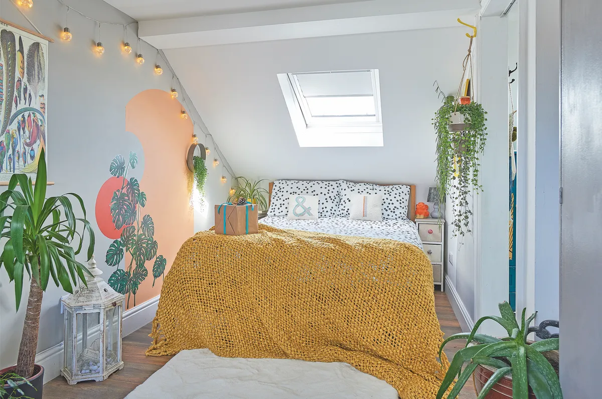 In her converted loft bedroom, Nikki couldn’t resist getting the brushes out to paint an abstract mural, in the same peachy oranges as the one in kitchen