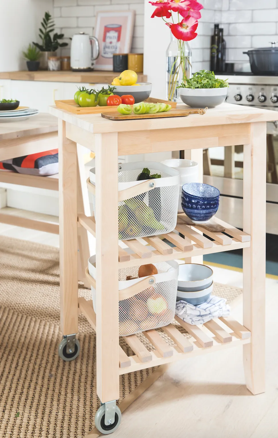 A handy trolley on wheels is useful in a small space, providing extra storage and a chopping board surface that can be moved around for convenience while cooking