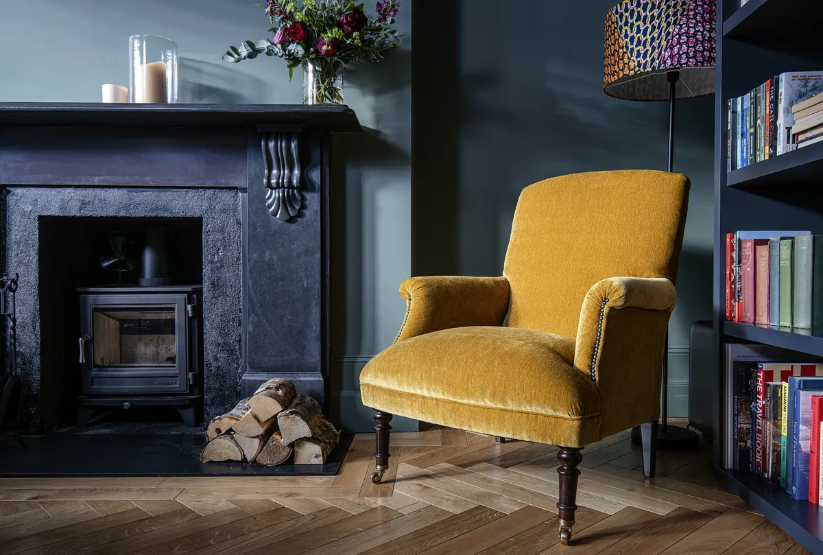 teal walls and mustard chair