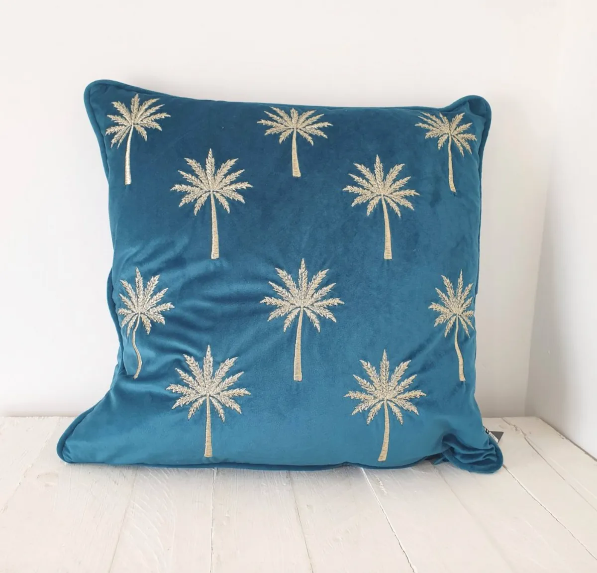Teal patterned cushion