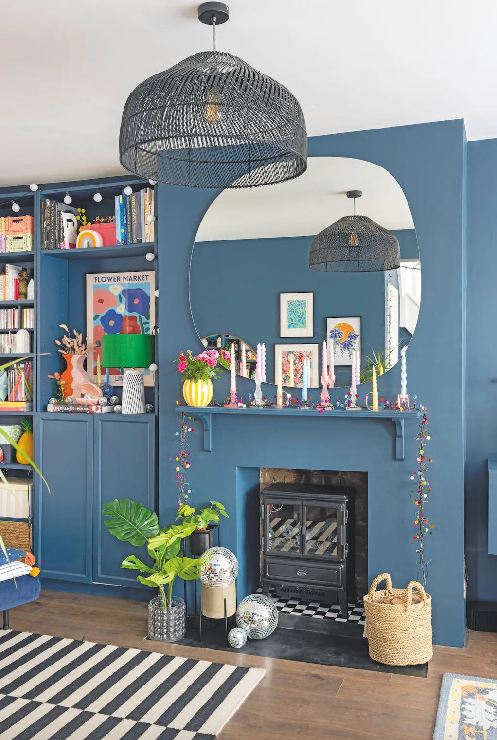 ‘I wanted a neat, streamlined fire surround, so I bought a cheap bookshelf, attached it with budget wooden brackets, and then painted it the same colour as the wall for a modern look’