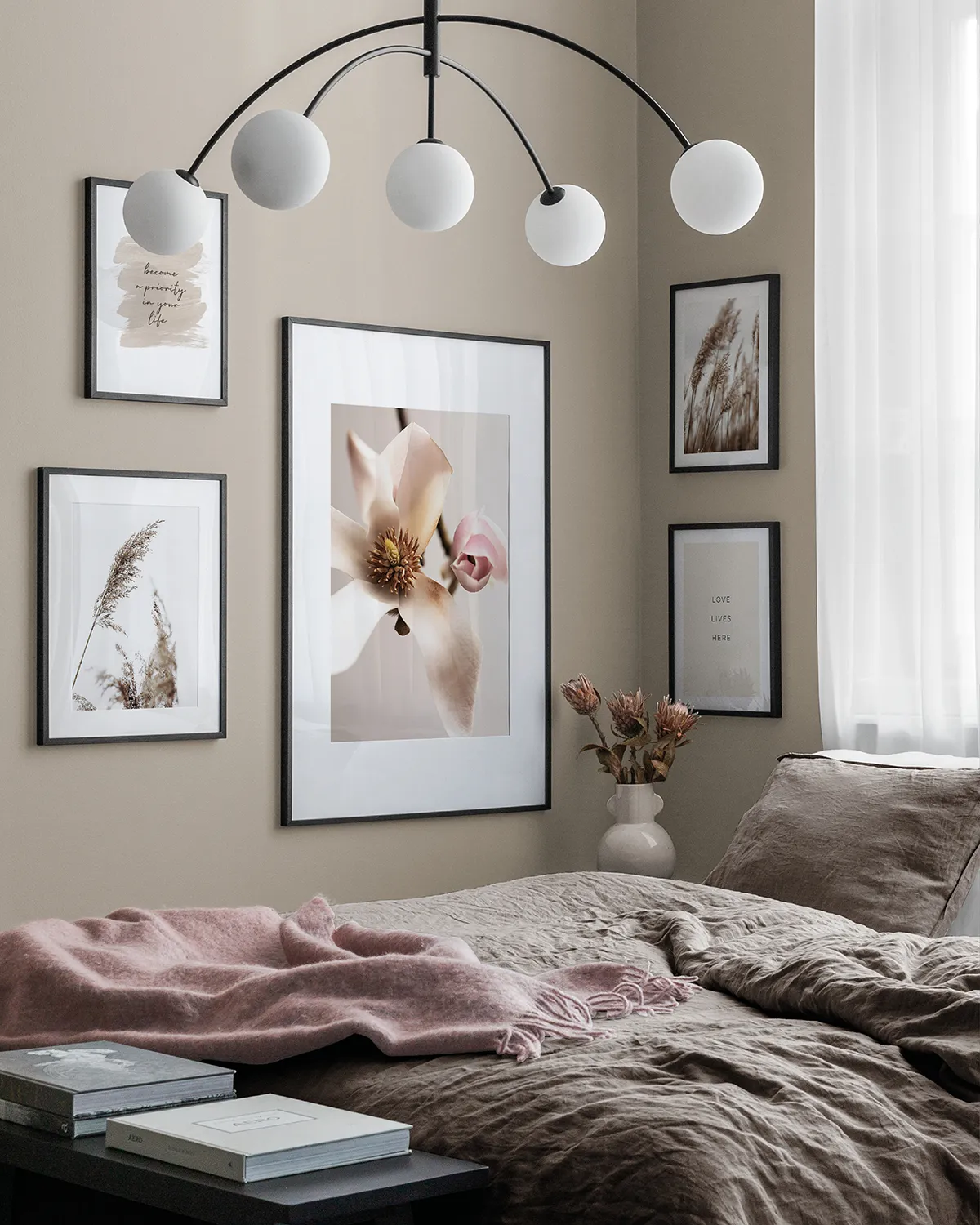 beige bedroom with statement lighting