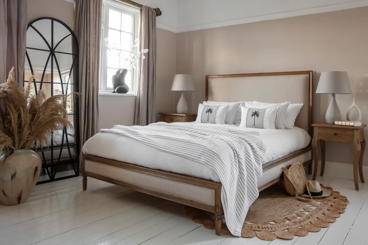beige bedroom with rattan rug
