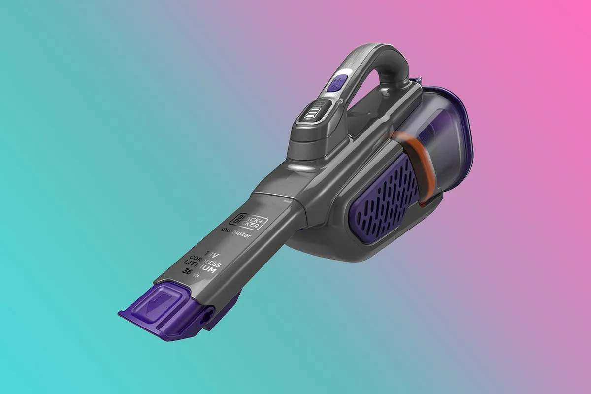 BLACK   DECKER Dustbuster Handheld Vacuum Cleaner on a pink and blue background
