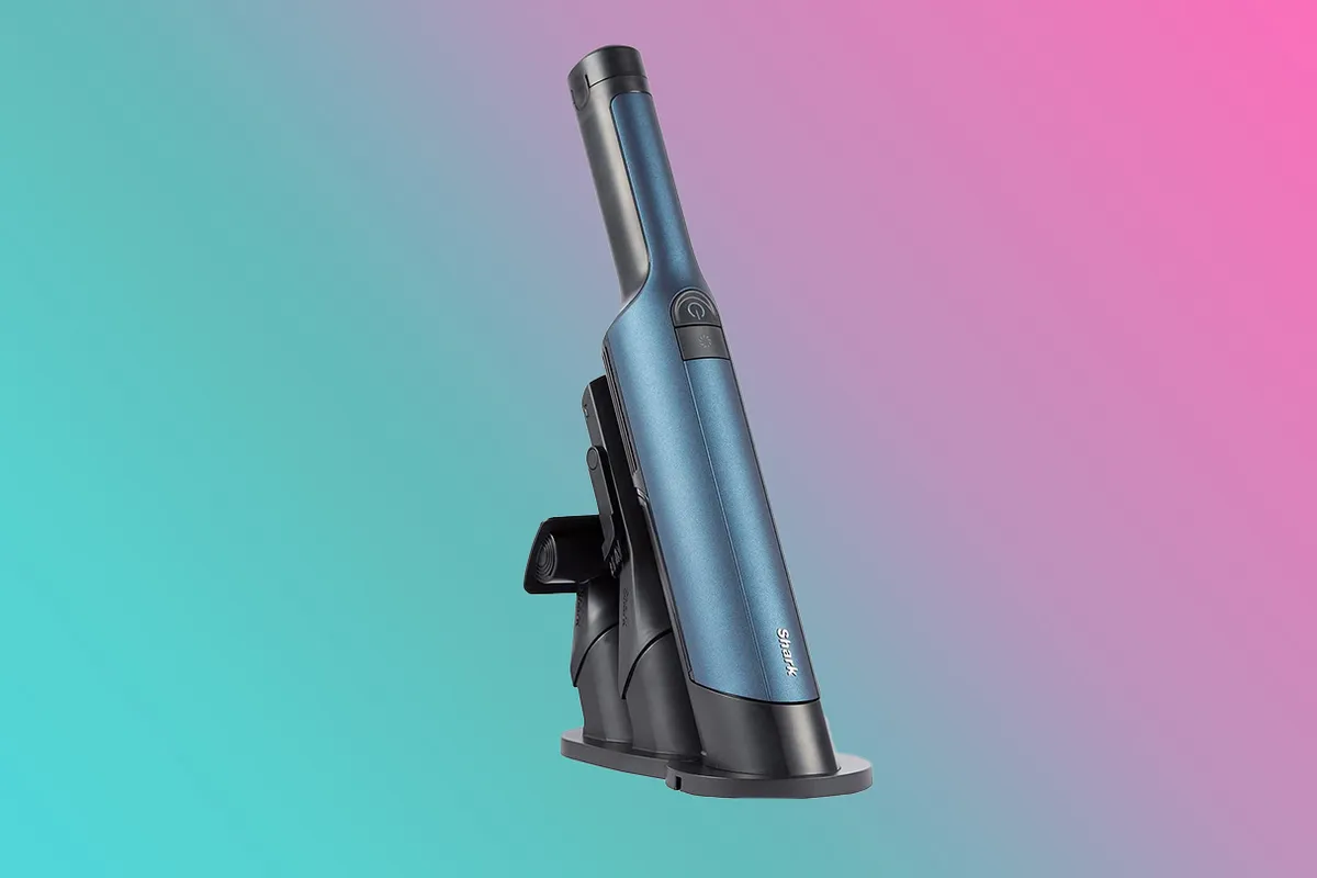Shark WandVac 2.0 Cordless Handheld Vacuum Cleaner on a pink and blue background