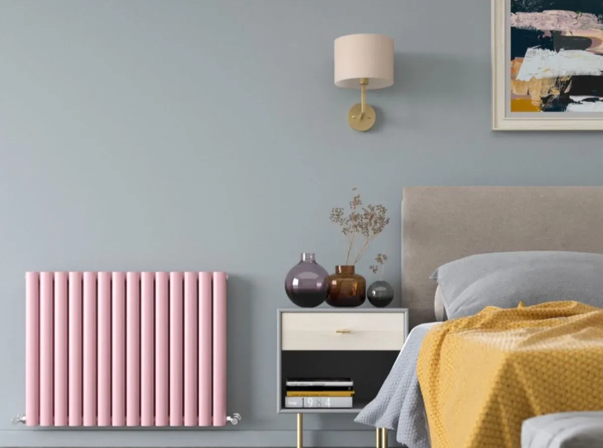 Pink radiator on wall
