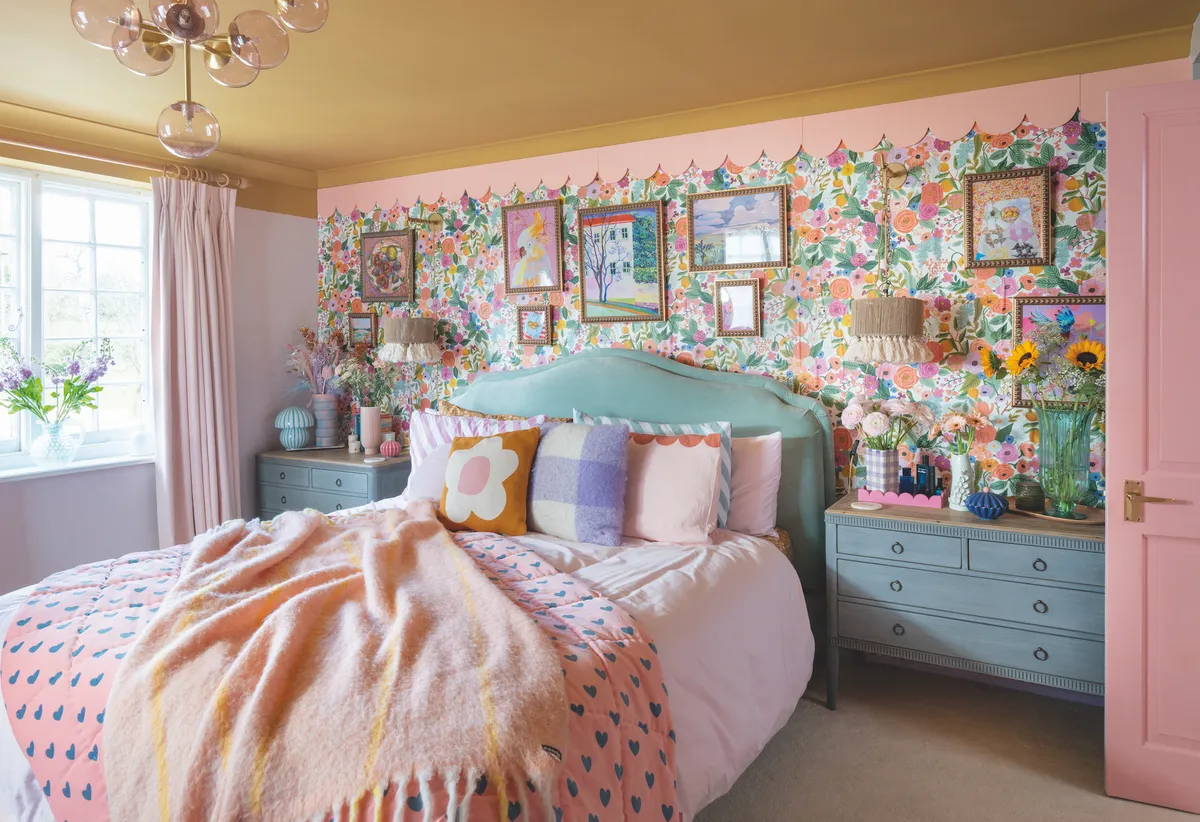 Continuing her trademark look, Sophia styled the master bedroom with floral wallpaper, pink accents and scallops galore