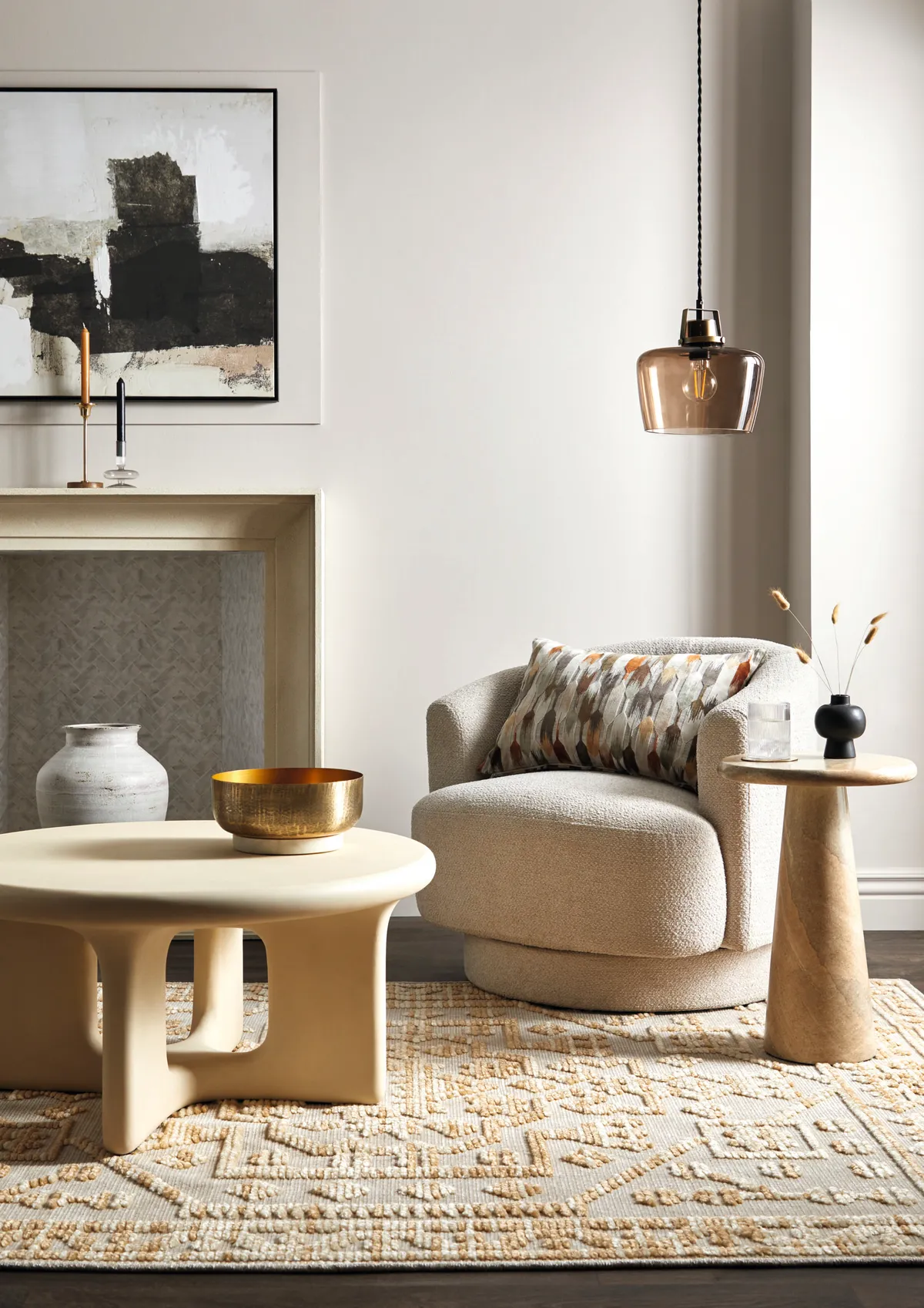 Carmen curved swivel chair in Chunky Ivory Chenille, £249; Rue coffee table, £379; Chiara side table, £249; Kelso cut velvet cushion in Natural, £25; Auburn single ceiling fitting, £35, all Dunelm