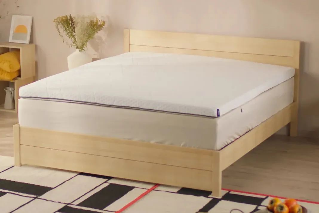 Emma Thermosync Mattress Topper on a bed
