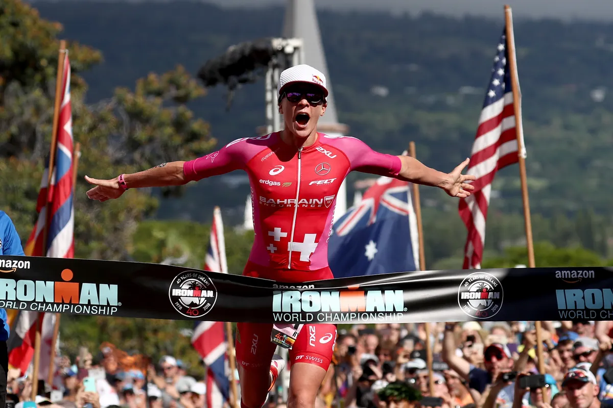 KAILUA KONA, HI - OCTOBER 13: Daniela Ryf of Switzerland celebrates after setting the course record of 8:26:16 to win the IRONMAN World Championships brought to you by Amazon on October 13, 2018 in Kailua Kona, Hawaii. (Photo by Al Bello/Getty Images for IRONMAN)