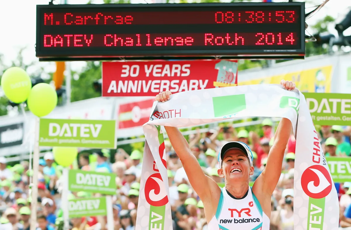 ROTH, GERMANY - JULY 20: Mirinda Carfrae of Australia celebrates winning the Challenge Roth on July 20, 2014 in Roth, Germany. (Photo by Alex Grimm/Getty Images)