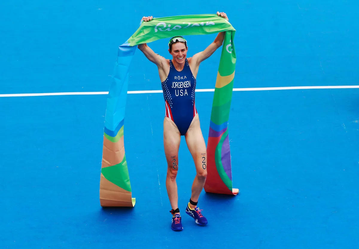 RIO DE JANEIRO, BRAZIL - AUGUST 20: Gwen Jorgensen of the United States celebrates as she wins gold during the Women's Triathlon on Day 15 of the Rio 2016 Olympic Games at Fort Copacabana on August 20, 2016 in Rio de Janeiro, Brazil. (Photo by Adam Pretty/Getty Images)